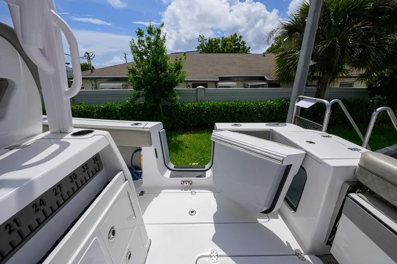 Slide: The Image of 2023 Sportsman Open 302 Center Console boat interior with open storage compartments. - 29