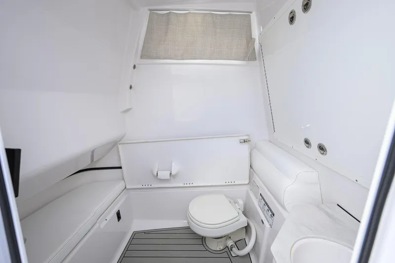 Slide: The Image of Interior of 2023 Sportsman Open 302 Center Console boat bathroom. - 31