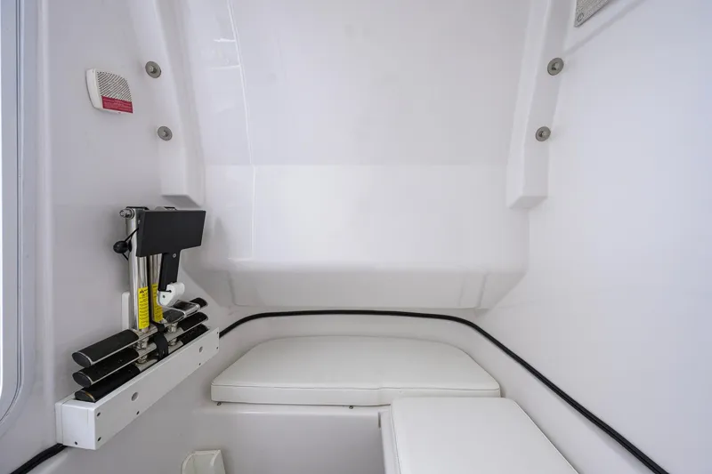 Slide: The Image of 2023 Sportsman Open 302 Center Console interior with seating and storage area. - 35
