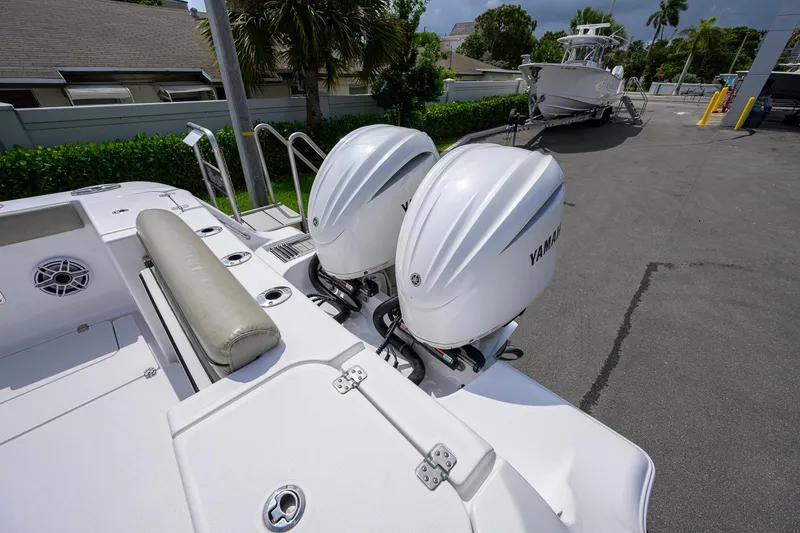 Slide: The Image of 2023 Sportsman Open 302 Center Console with twin Yamaha outboard engines. - 36