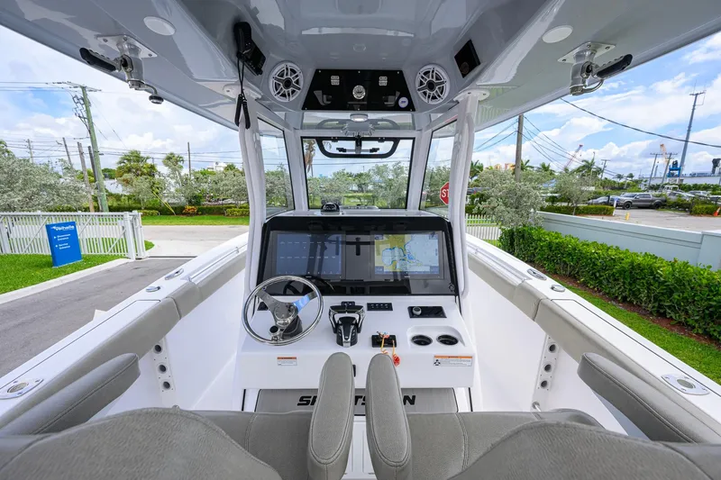 Slide: The Image of 2023 Sportsman Open 302 Center Console boat interior with advanced navigation system. - 6