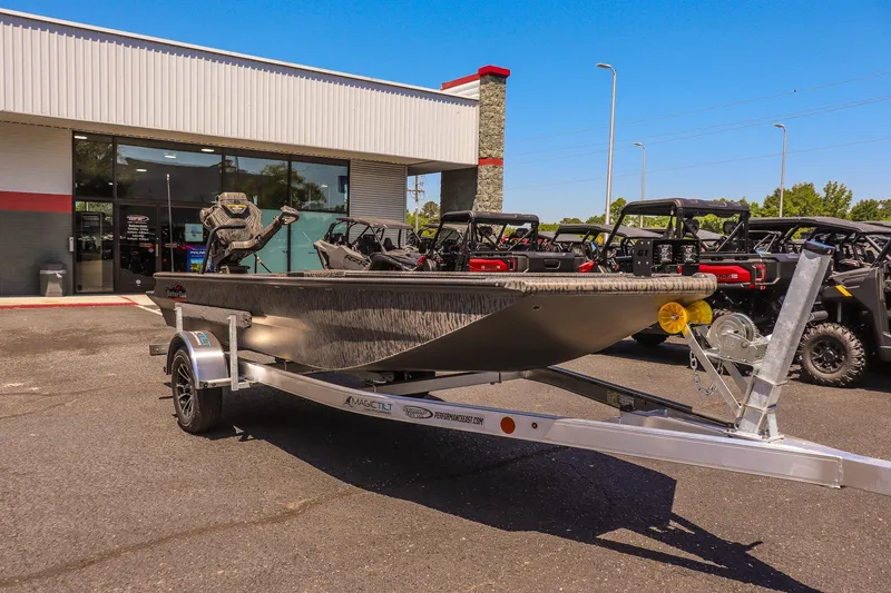 The Image of 2026 Gator Tail 18/60 Extreme Series boat on trailer, parked outside dealership. - 1