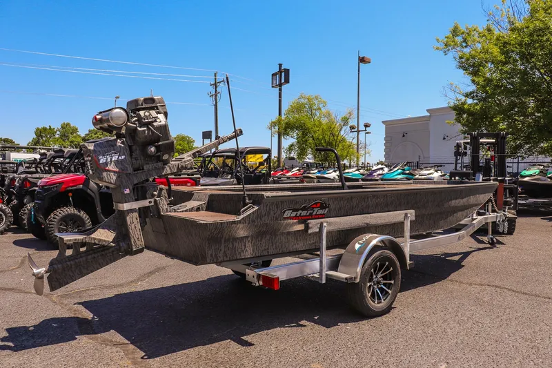 Slide: The Image of 2026 Gator Tail 18/60 Extreme Series boat on trailer, parked outdoors. - 3