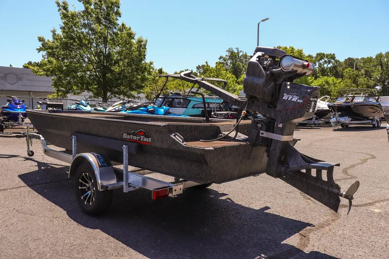 Slide: The Image of 2026 Gator Tail 18/60 Extreme Series boat on trailer in sunny outdoor setting. - 5