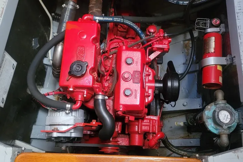 Slide: The Image of Red Bukh engine in a 1936 Freeman 37 boat, with visible fire extinguisher and hoses. - 17