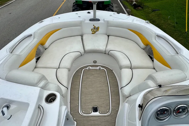 Slide: The Image of 2014 Hurricane SunDeck Sport 203 OB boat interior with white and yellow seating. - 10