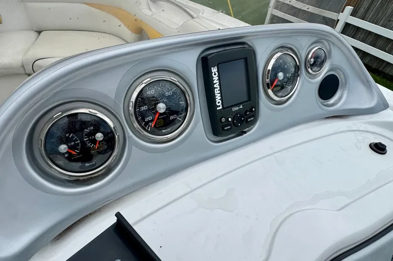 Slide: The Image of Dashboard of 2014 Hurricane SunDeck Sport 203 OB with gauges and Lowrance Elite-4 display. - 11