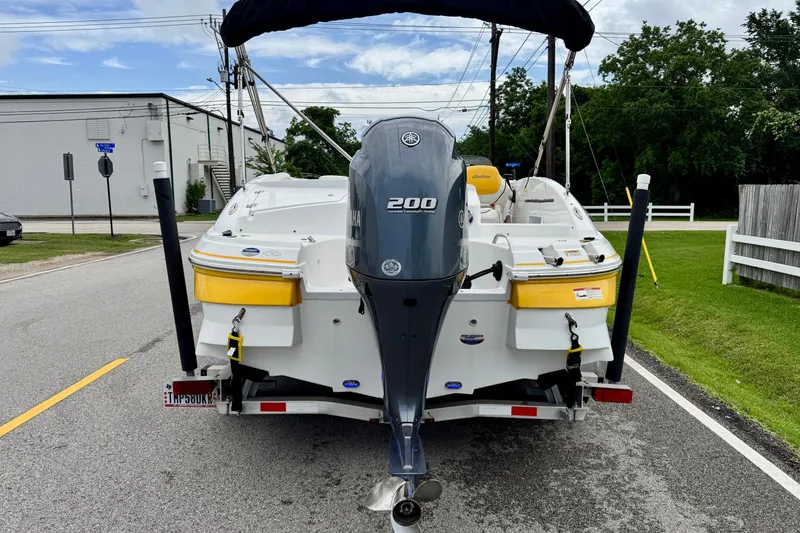 Slide: The Image of 2014 Hurricane SunDeck Sport 203 OB boat with Yamaha 200 engine on trailer. - 3