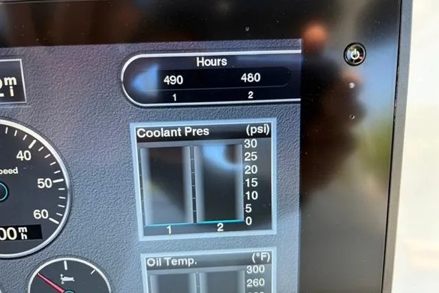 Slide: The Image of Dashboard display of a 2019 Yellowfin 32 Offshore showing engine hours, coolant pressure, and oil temperature. - 6