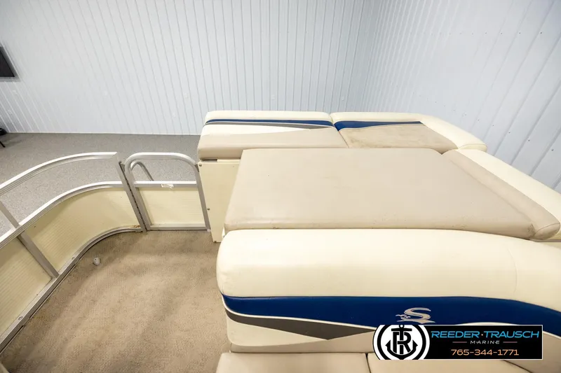 Slide: The Image of 2008 Sedona 20 CR pontoon boat interior with beige and blue seating. - 15