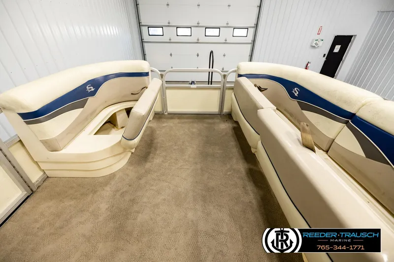 Slide: The Image of Interior view of a 2008 Sedona 20 CR pontoon boat with beige seating. - 19