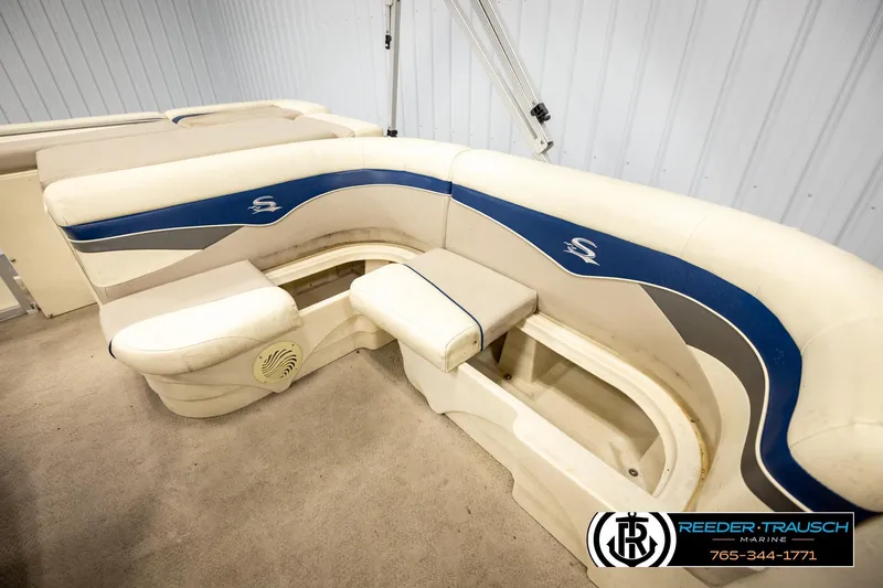 Slide: The Image of Luxurious seating on a 2008 Sedona 20 CR boat, featuring blue and white upholstery. - 21