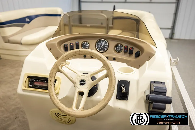 Slide: The Image of Steering console of a 2008 Sedona 20 CR boat with gauges and controls. - 26