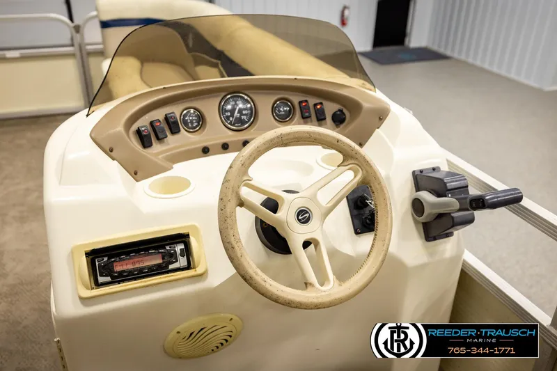 Slide: The Image of Steering console of a 2008 Sedona 20 CR boat with controls and gauges. - 27