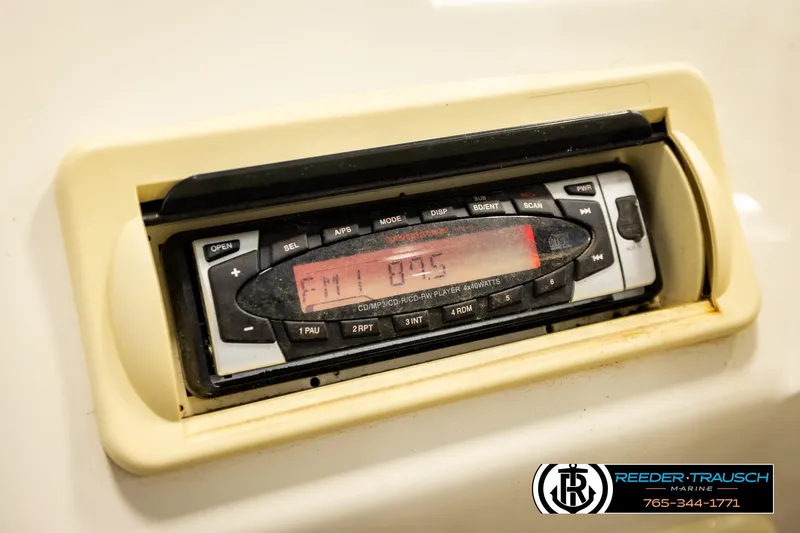 Slide: The Image of 2008 Sedona 20 CR boat stereo system displaying FM radio station. - 29