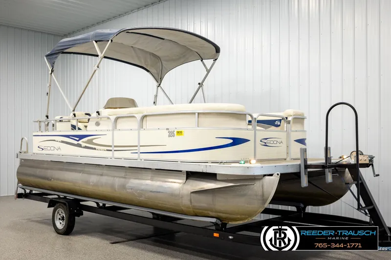 Slide: The Image of 2008 Sedona 20 CR pontoon boat on trailer in indoor storage facility. - 3