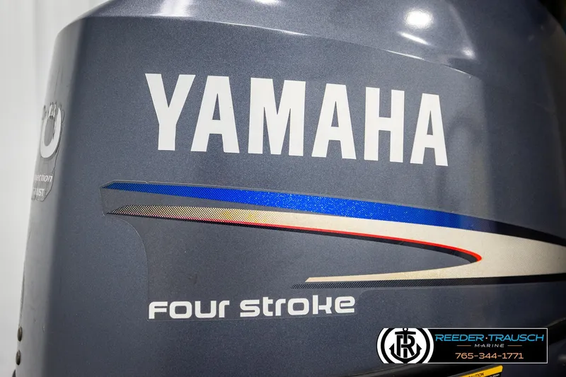 Slide: The Image of Yamaha four-stroke engine cover with logo and Reeder-Trausch Marine contact details. - 39