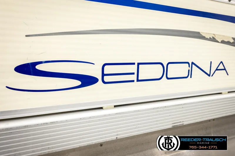 Slide: The Image of Close-up of 2008 Sedona 20 CR boat logo with Reeder-Trausch Marine branding. - 43