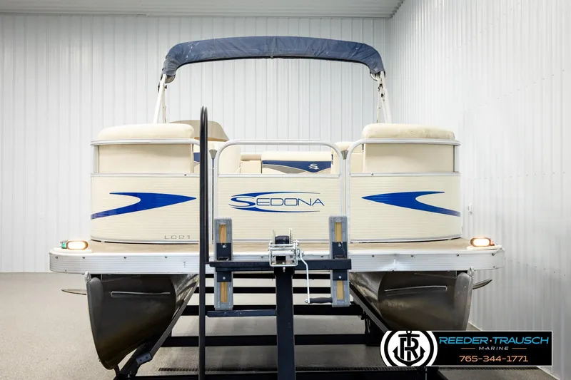Slide: The Image of 2008 Sedona 20 CR pontoon boat on trailer in indoor storage facility. - 8