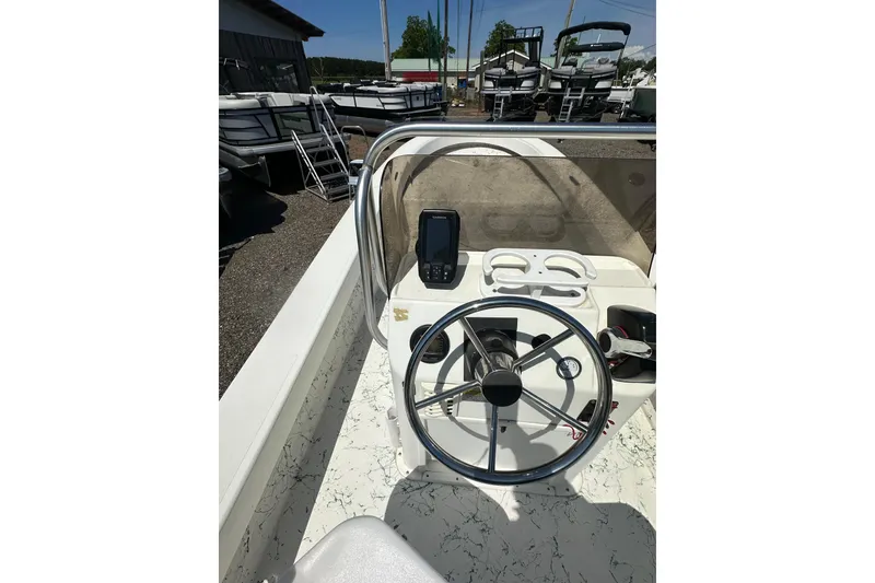 Slide: The Image of 2007 Panga Marine 18 boat cockpit with steering wheel and navigation equipment. - 13