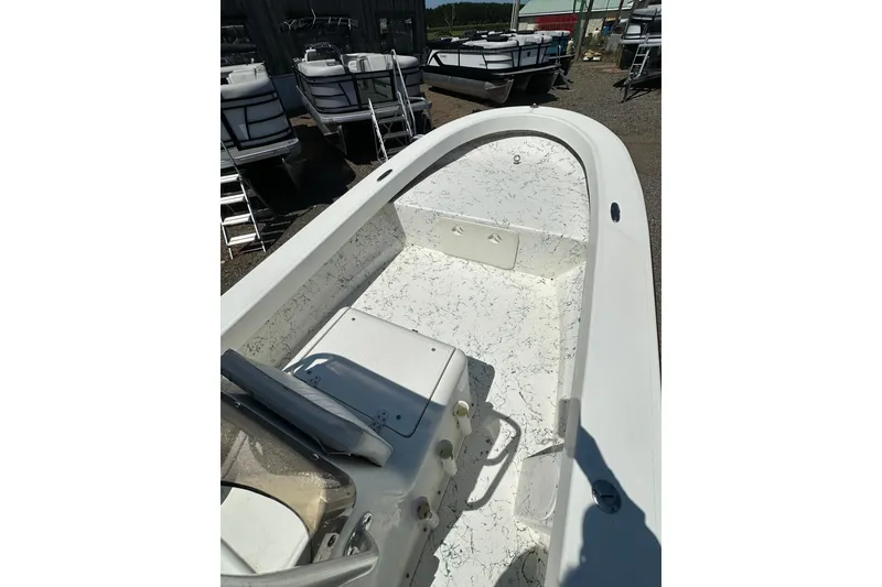 Slide: The Image of 2007 Panga Marine 18 boat interior, featuring a clean, spacious deck and seating area. - 14