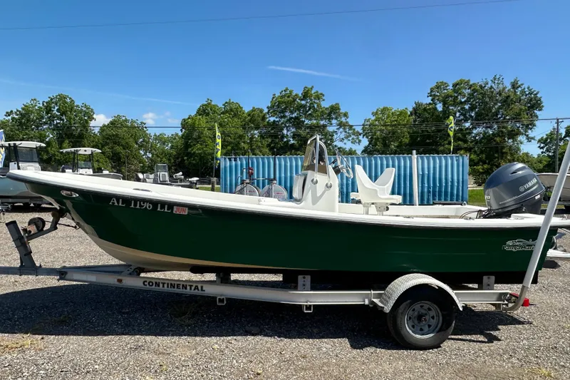 Slide: The Image of 2007 Panga Marine 18 boat on trailer, green hull, parked outdoors. - 2