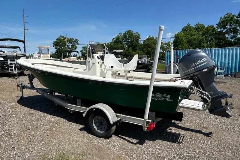 Slide: The Image of 2007 Panga Marine 18 boat with Yamaha motor on trailer, parked outdoors. - 3