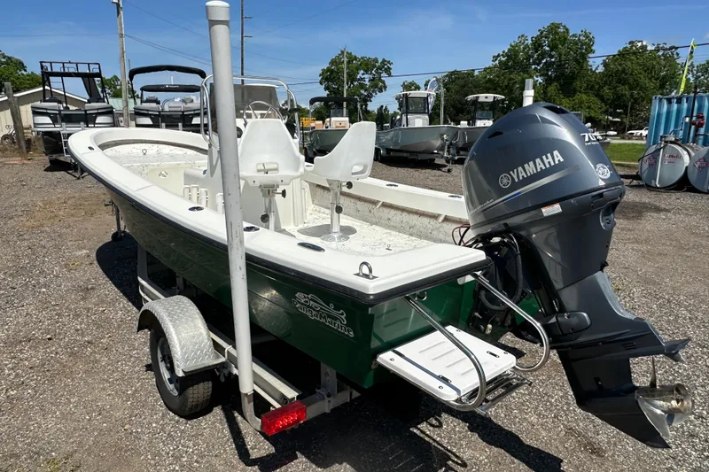 Slide: The Image of 2007 Panga Marine 18 boat with Yamaha motor on trailer, parked outdoors. - 4