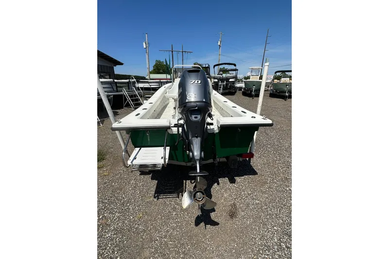 Slide: The Image of 2007 PANGA MARINE 18 boat with outboard motor, parked on gravel lot. - 5
