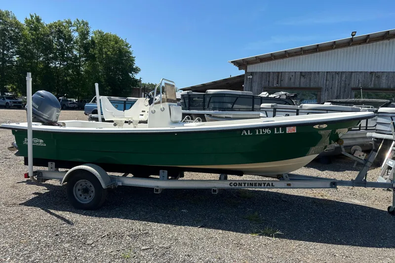 Slide: The Image of 2007 Panga Marine 18 boat on trailer, green hull, parked outdoors. - 8