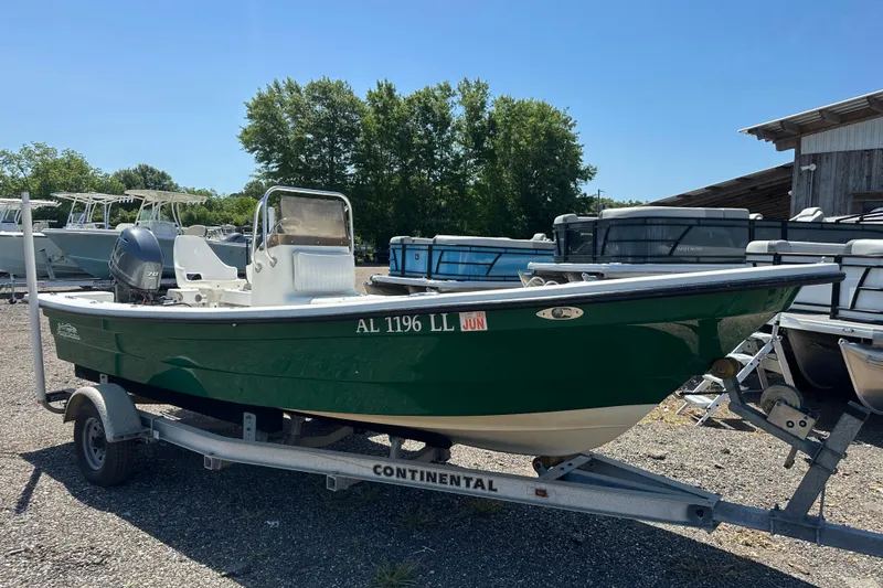 Slide: The Image of 2007 Panga Marine 18 boat on trailer, green hull, parked outdoors. - 9