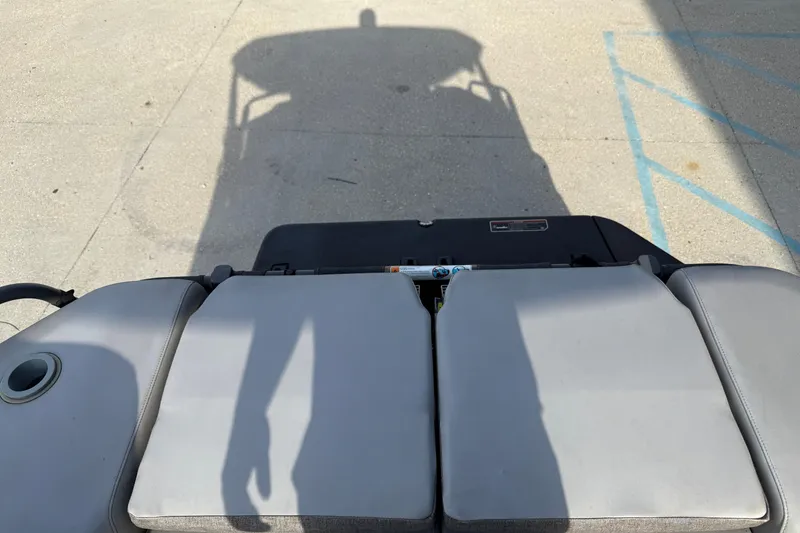 Slide: The Image of 2023 Sea-Doo Switch Sport 18 with shadow on deck, showcasing seating and design. - 14