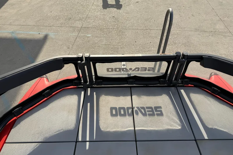 Slide: The Image of 2023 Sea-Doo Switch Sport 18 deck with logo shadow on textured surface. - 18