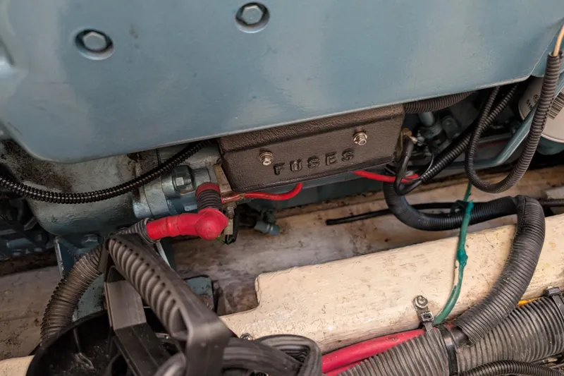 Slide: The Image of Engine compartment of 2004 Albin 30 Family Cruiser with visible wiring and fuse box. - 51