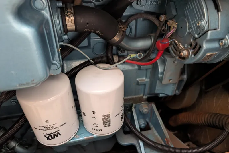 Slide: The Image of Engine components of a 2004 Albin 30 Family Cruiser with Wix filters visible. - 52