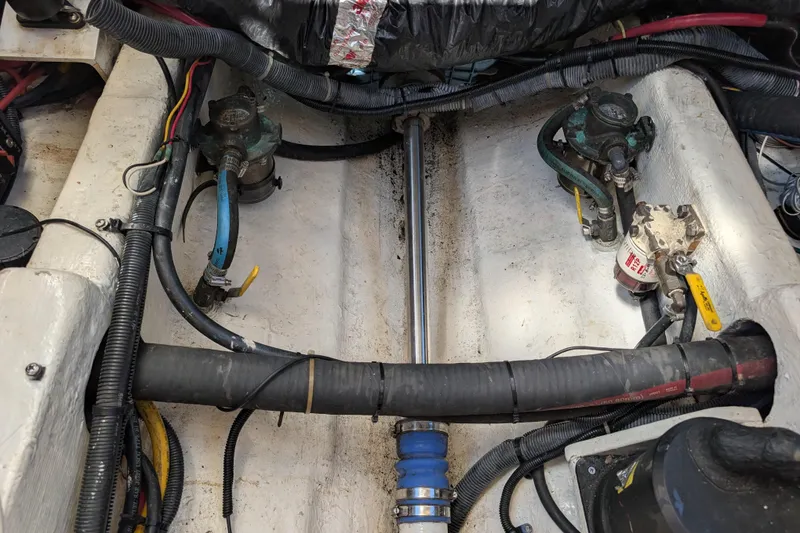 Slide: The Image of Engine compartment of a 2004 Albin 30 Family Cruiser with visible wiring and components. - 59