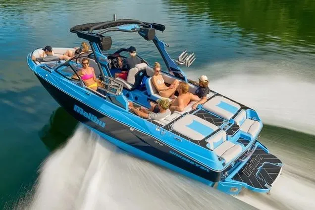 Slide: The Image of Manufacturer Provided Image: 2026 Malibu Wakesetter 23 LSV boat cruising on a lake with passengers enjoying the ride. - 3