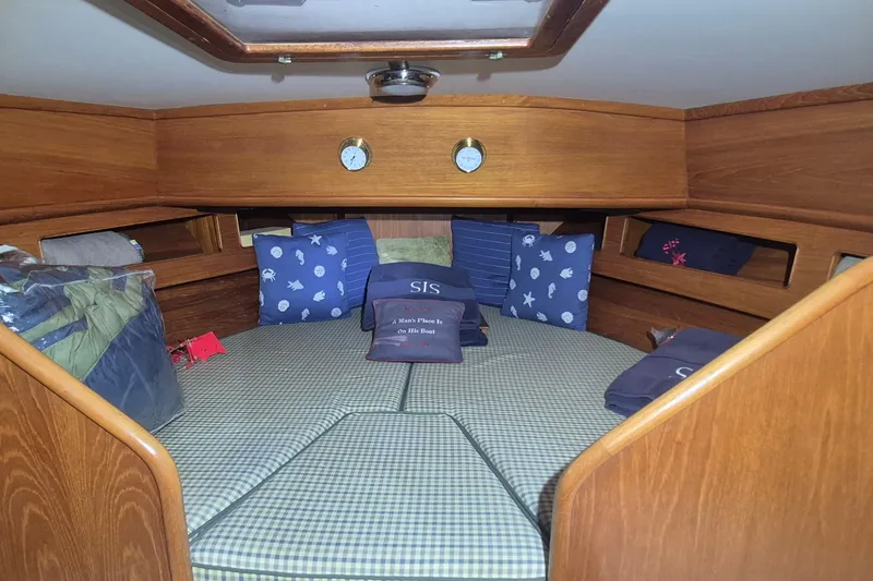 Slide: The Image of Cozy cabin interior of 1990 Little Harbor Express yacht with nautical-themed pillows. - 14