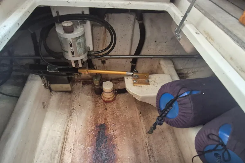Slide: The Image of Engine compartment of a 1990 Little Harbor Express boat, showing mechanical components and fenders. - 20