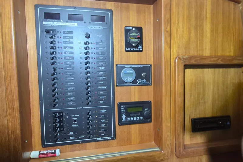 Slide: The Image of Control panel of a 1990 Little Harbor Express boat with wooden finish. - 22