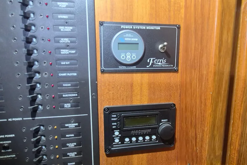 Slide: The Image of Control panel of a 1990 Little Harbor Express boat with power system monitor. - 25