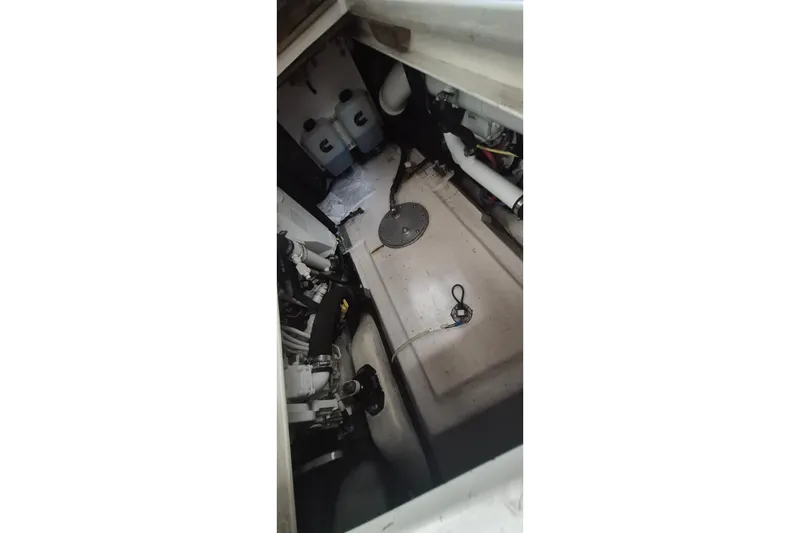 Slide: The Image of Engine room of a 1990 Little Harbor Express boat, showcasing mechanical components. - 32