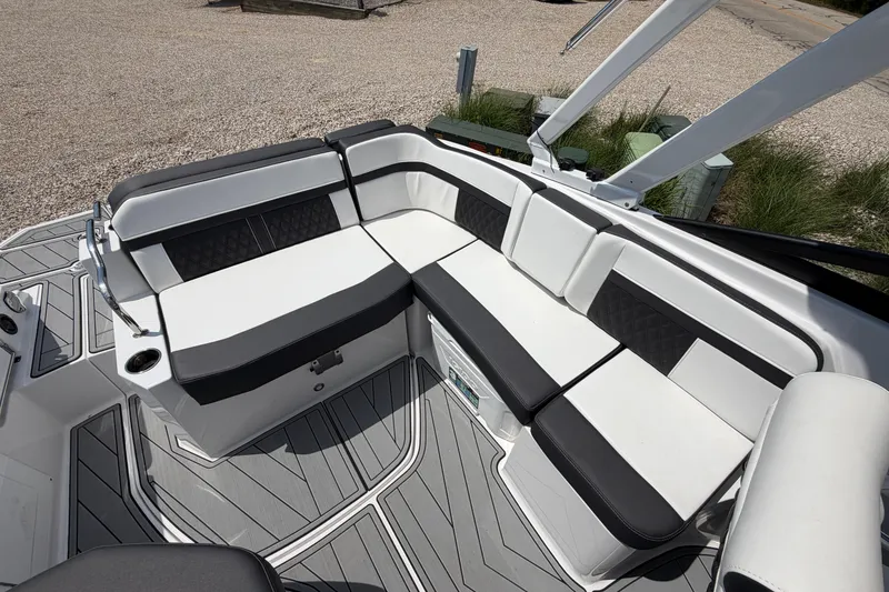 Slide: The Image of Luxurious seating area on a 2025 Monterey M6 boat, featuring sleek black and white upholstery. - 10