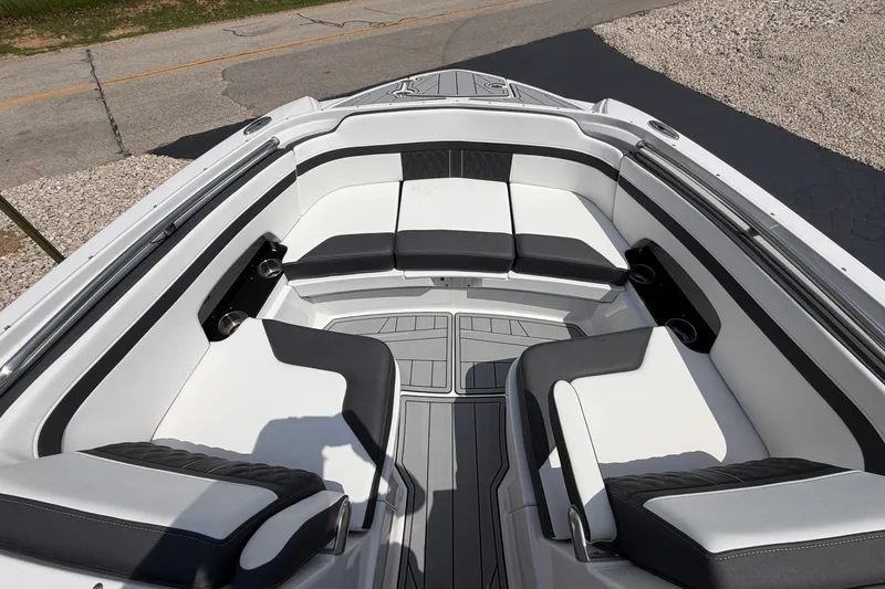 Slide: The Image of 2025 Monterey M6 boat interior with sleek white and black seating, showcasing modern design. - 20