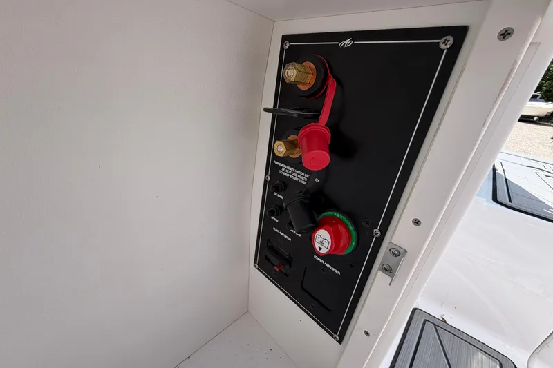 Slide: The Image of Control panel of a 2025 Monterey M6 boat with switches and connectors. - 25