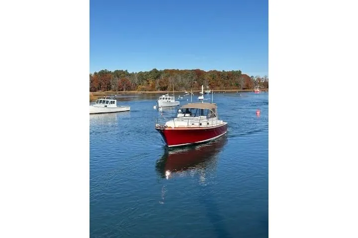 Slide: The Image of 1998 Grand Banks 38 Eastbay EX cruising on a serene lake with autumn foliage. - 24
