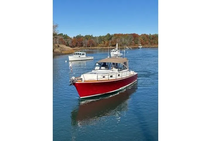 Slide: The Image of 1998 Grand Banks 38 Eastbay EX cruising on a serene river with autumn foliage. - 27