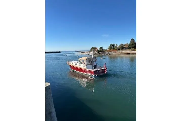 Slide: The Image of 1998 Grand Banks 38 Eastbay EX cruising on a calm, scenic waterway. - 39