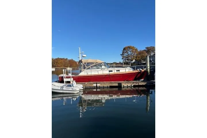 Slide: The Image of 1998 Grand Banks 38 Eastbay EX yacht docked on a sunny day. - 4