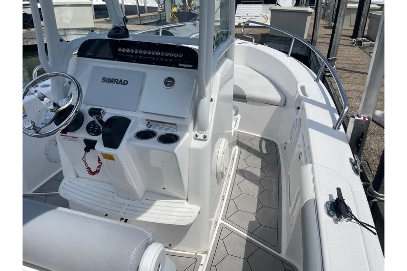 Slide: The Image of 2018 Everglades 230 Center Console boat interior with Simrad navigation system. - 15